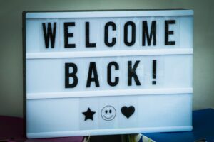 sign saying welcome back