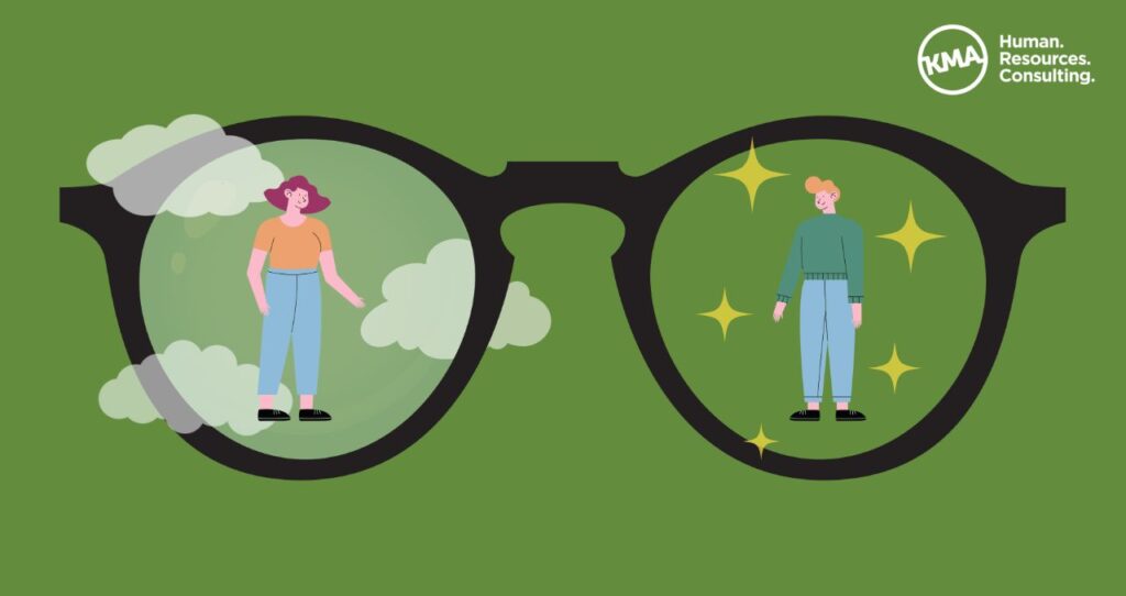 A graphic of eyeglasses with two people in the lenses.